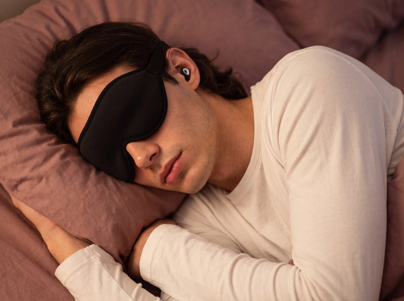 Man sleeping on his side wearing a sleep mask designed for side sleepers